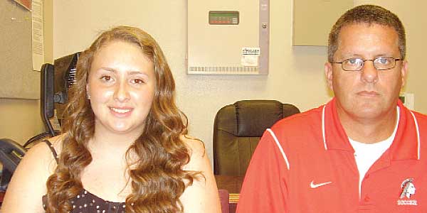Pictured are Fort Osage goalkeeper Lydia Calderon (left) and soccer coach Andrew Fletcher. (Photo by Shawn Roney)