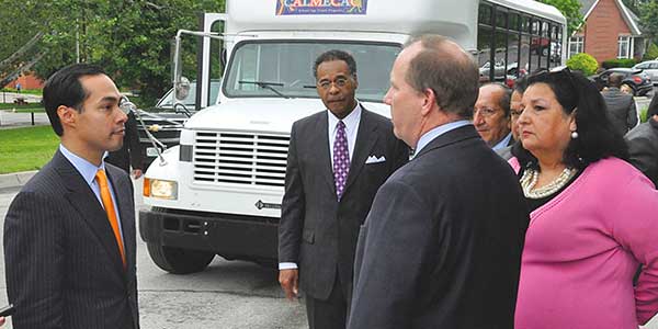   HUD Secretary Julian Castro talks with the people while U.S. Congressman Emanuel Cleaver II watches. Photo courtesy Westside Housing Organization